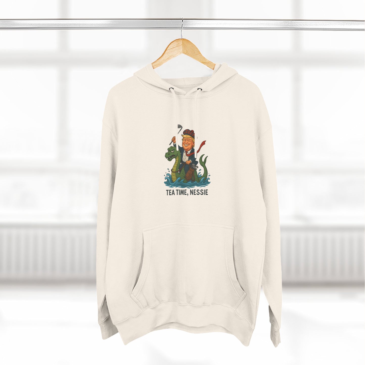 Nessie Tea Time Hoodie, Cozy Sweatshirt for Dragon Lovers, Gift for Tea Enthusiasts, Fun Highland Mythology Apparel, Comfortable Casual Wear Printify