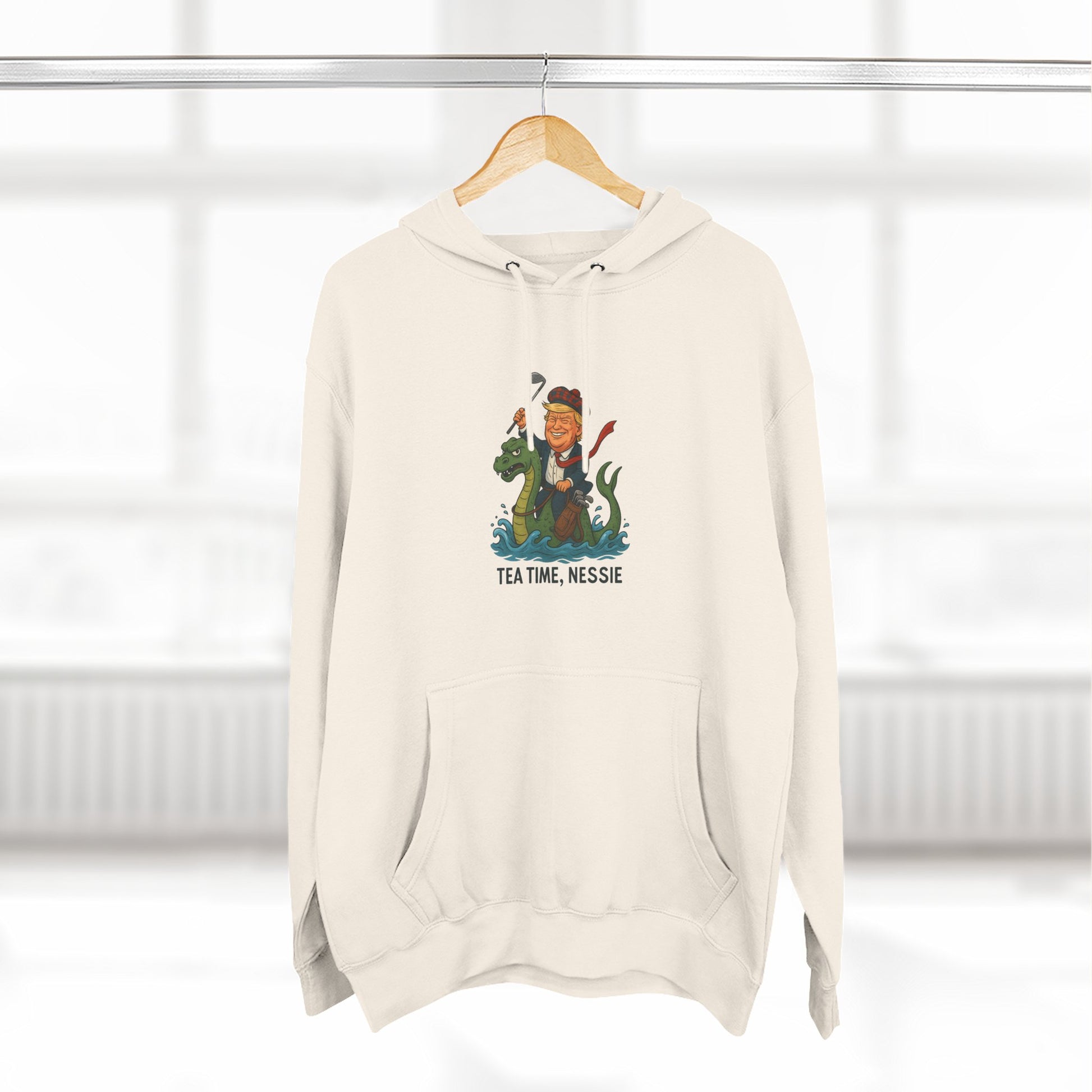 Nessie Tea Time Hoodie, Cozy Sweatshirt for Dragon Lovers, Gift for Tea Enthusiasts, Fun Highland Mythology Apparel, Comfortable Casual Wear Printify