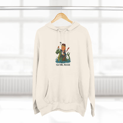 Nessie Tea Time Hoodie, Cozy Sweatshirt for Dragon Lovers, Gift for Tea Enthusiasts, Fun Highland Mythology Apparel, Comfortable Casual Wear Printify