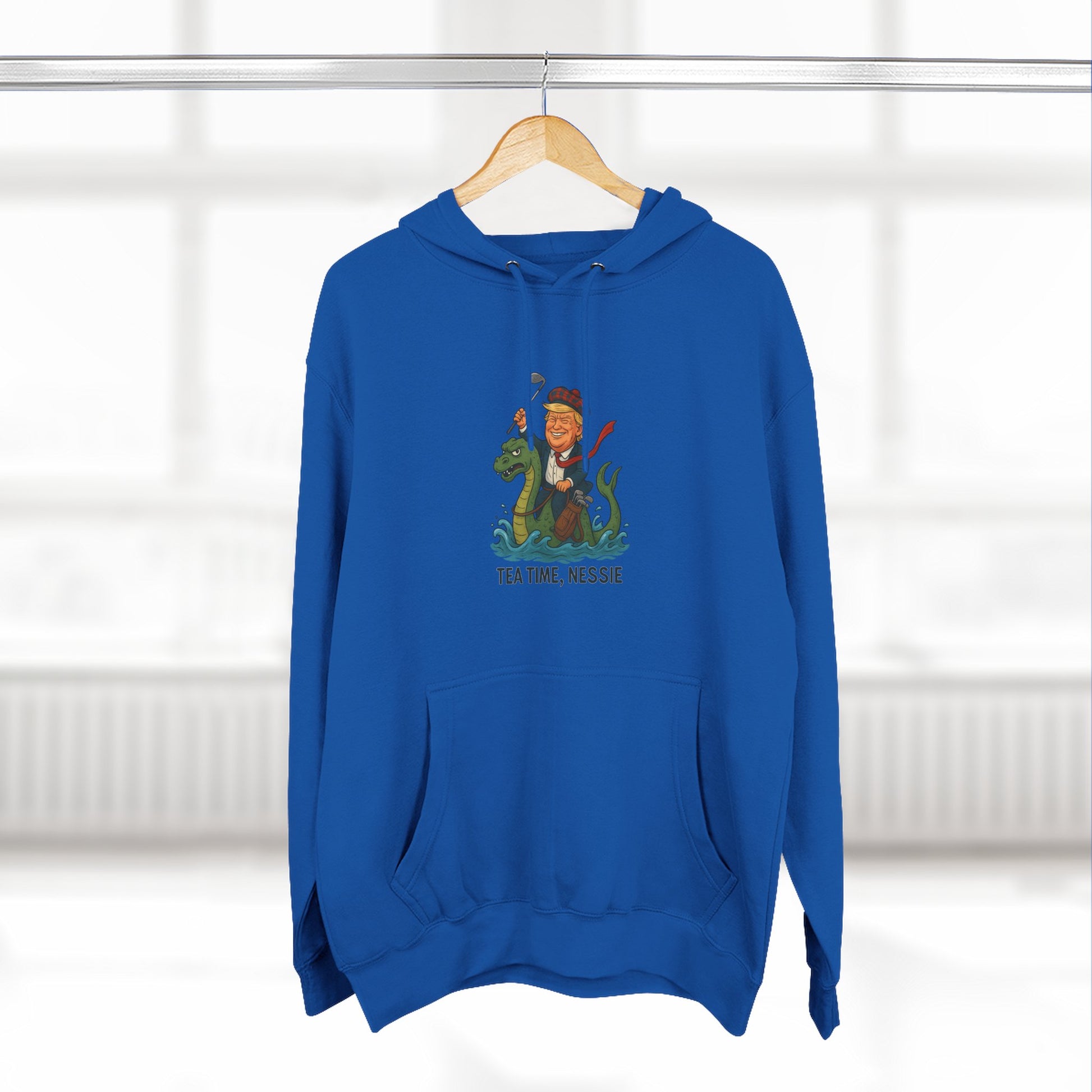 Nessie Tea Time Hoodie, Cozy Sweatshirt for Dragon Lovers, Gift for Tea Enthusiasts, Fun Highland Mythology Apparel, Comfortable Casual Wear Printify