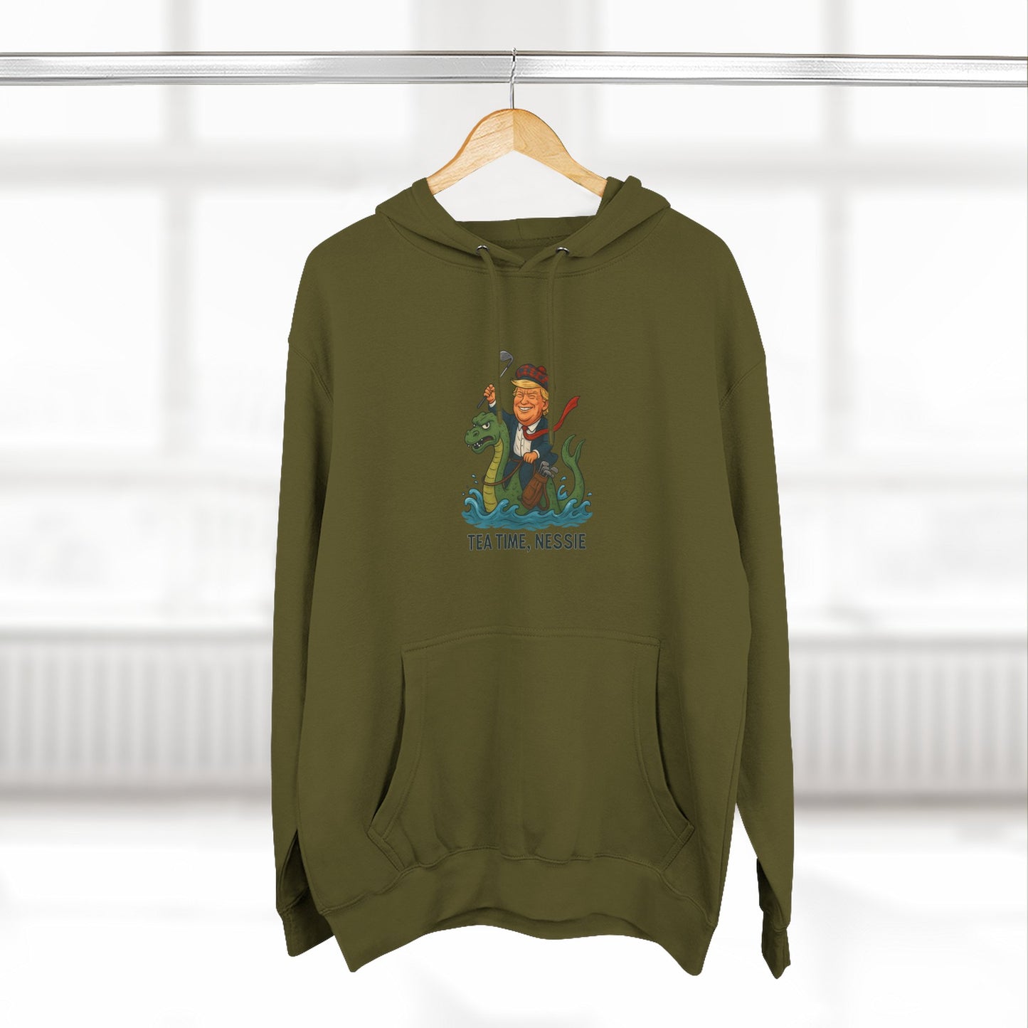 Nessie Tea Time Hoodie, Cozy Sweatshirt for Dragon Lovers, Gift for Tea Enthusiasts, Fun Highland Mythology Apparel, Comfortable Casual Wear Printify