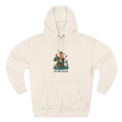 Nessie Tea Time Hoodie, Cozy Sweatshirt for Dragon Lovers, Gift for Tea Enthusiasts, Fun Highland Mythology Apparel, Comfortable Casual Wear Printify